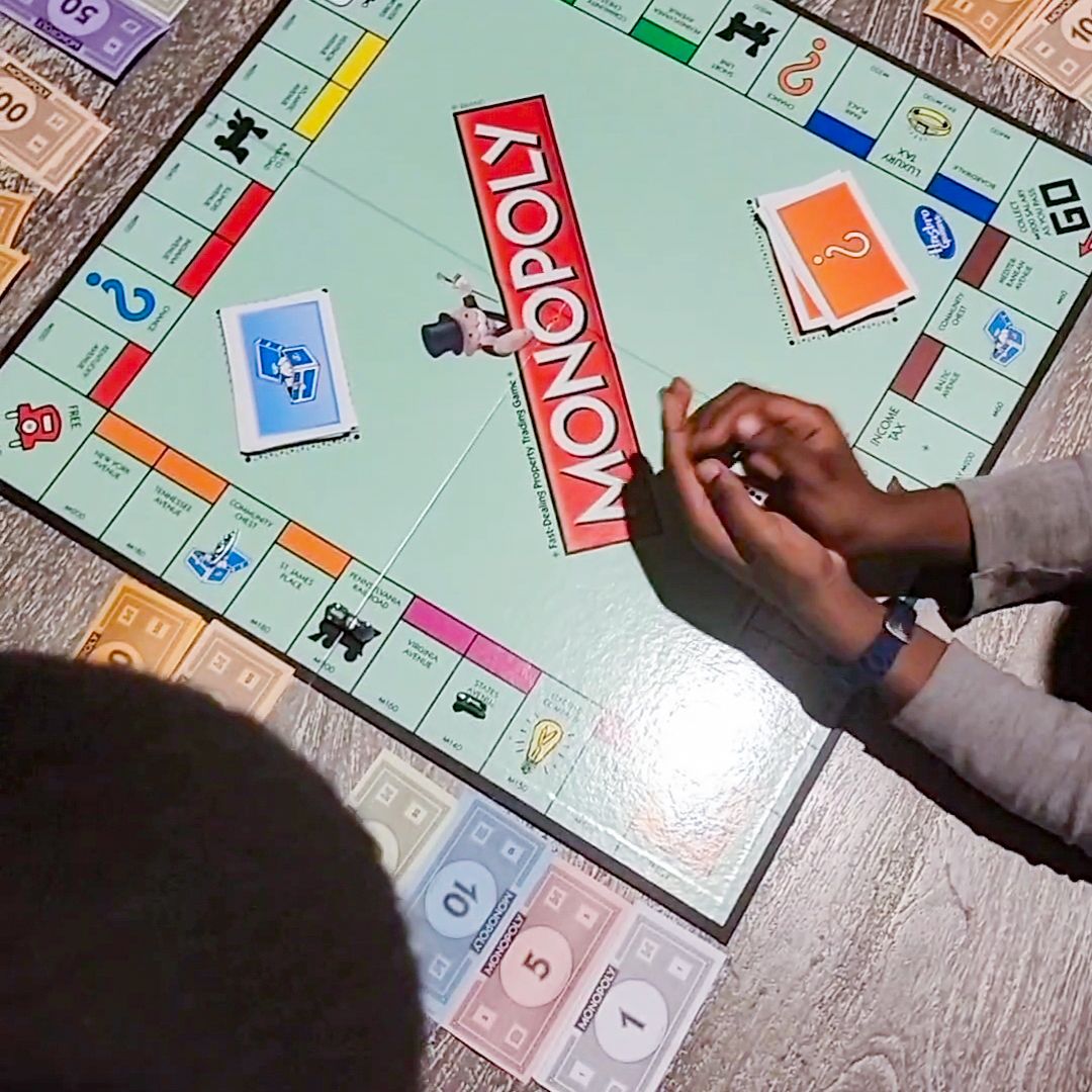 Kids playing monopoly
